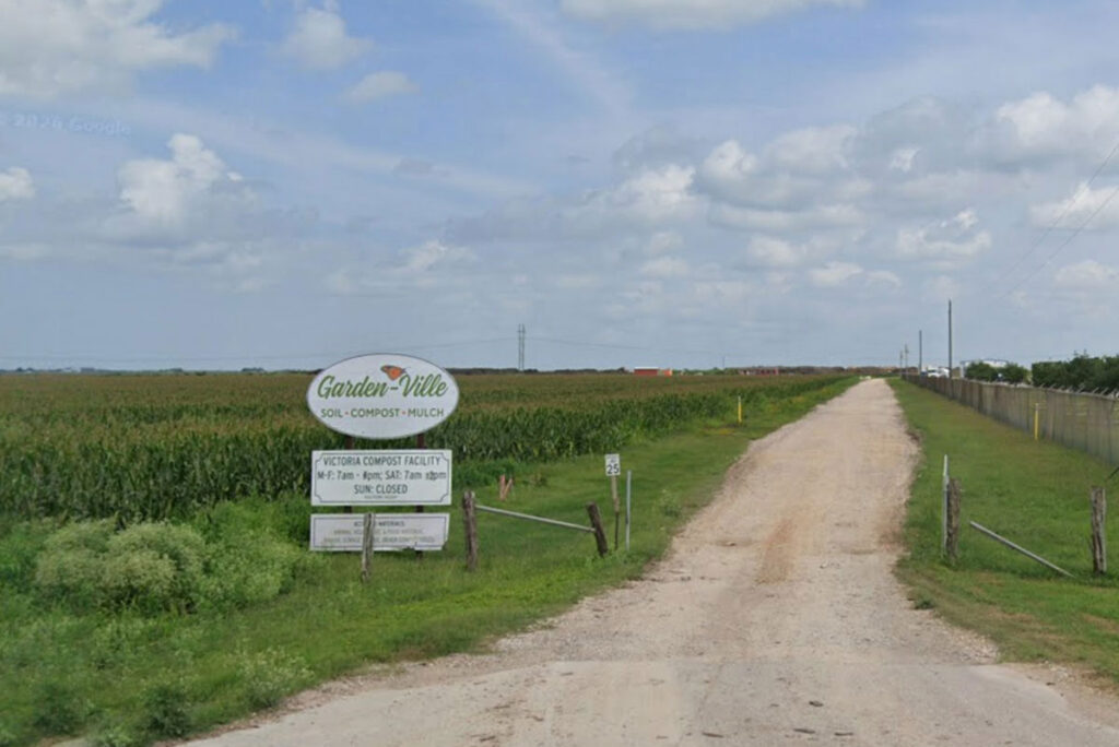 Entrance road and sign at Garden-Ville Victoria
